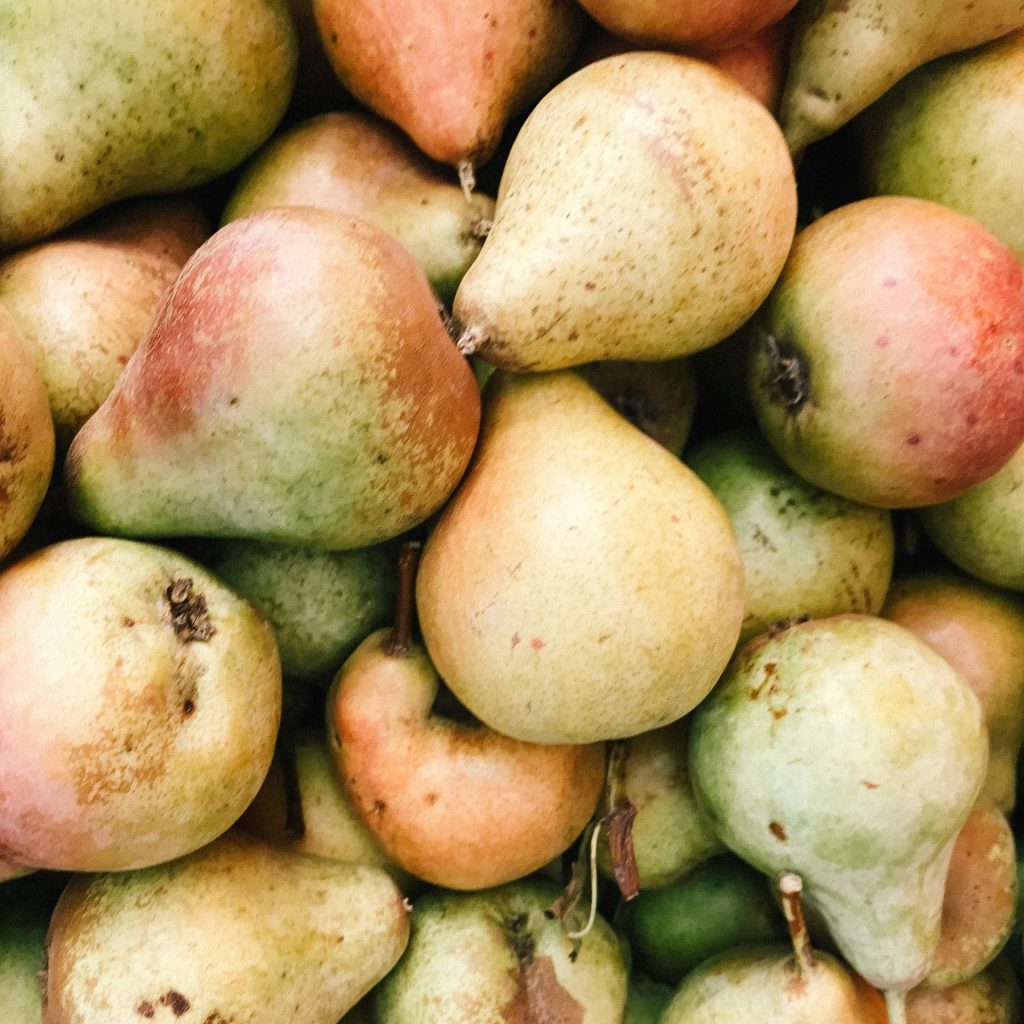 Close-up of fresh organic pears showcasing their natural vibrancy and texture.